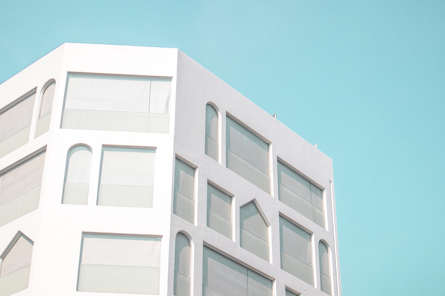 Pale building against a clear blue sky